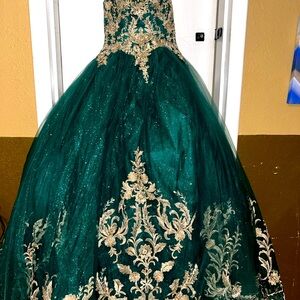 Quinceneara dress size small.  Emerald green with gold and glitter accents.